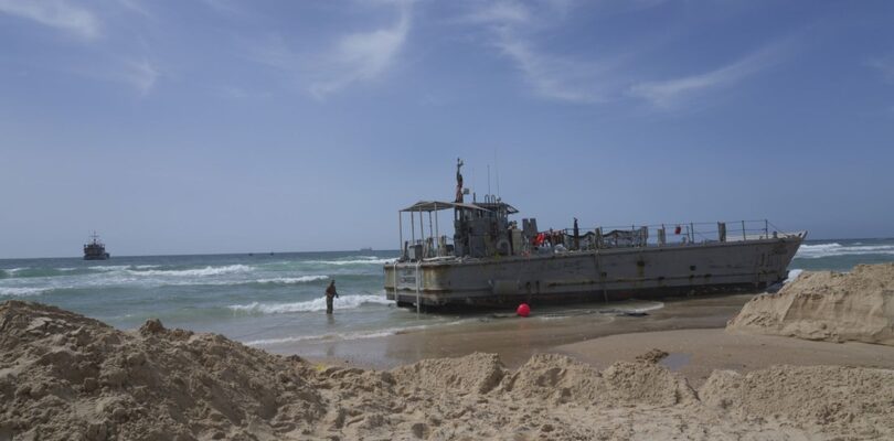 Aid deliveries suspended after rough seas damage US-built Gaza pier