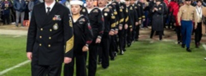 U.S. Navy Recruiters of the Year walk onto the Field for an Swear in Ceremony during the Army Navy Game