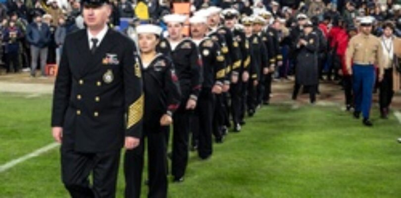 U.S. Navy Recruiters of the Year walk onto the Field for an Swear in Ceremony during the Army Navy Game